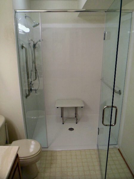 Fiberglass curbless shower with custom glass door in Salem virginia